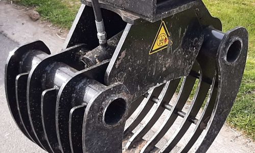 Sloop en sorteergrijper vast